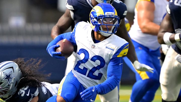 Aug 9, 2025; Inglewood, California, USA;  Los Angeles Rams running back Blake Corum (22) runs past Dallas Cowboys linebacker Marist Liufau (35) for a first down during the first half at SoFi Stadium. Mandatory Credit: Jayne Kamin-Oncea-Imagn Images