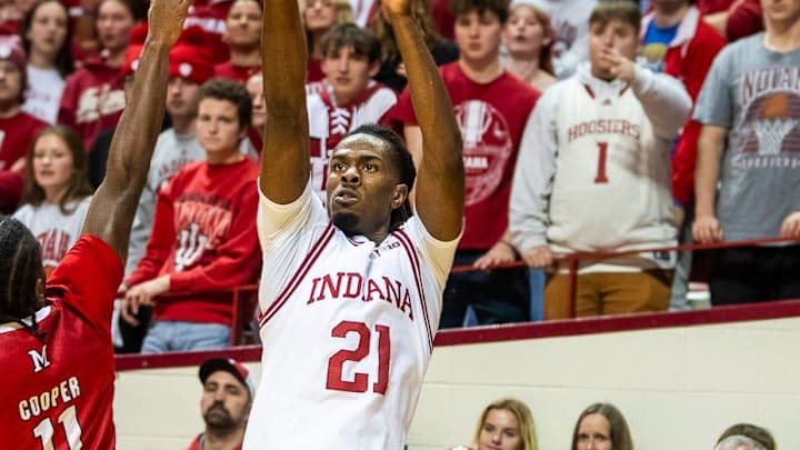 Indiana's Mackenzie Mgbako (21) shoots over Miami's Mekhi Cooper (11) during the Indiana versus Miami (Ohio) men's basketball game at Simon Skjodt Asseembly Hall on Friday, Dec. 6, 2024.