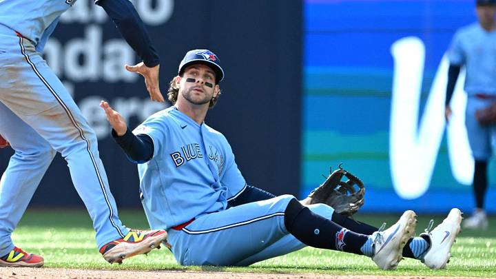 Jun 6, 2026; Toronto, Ontario, CAN; Toronto Blue Jays second baseman Ernie Clement (22) is greeted by shortstop Andres Gimenez (0) after throwing out Baltimore Orioles first baseman Pete Alonso (not shown) while sitting on the ground in the eighth inning at Rogers Centre. Mandatory Credit: Dan Hamilton-Imagn Images Jun 6, 2026; Toronto, Ontario, CAN; Toronto Blue Jays second baseman Ernie Clement (22) is greeted by shortstop Andres Gimenez (0) after throwing out Baltimore Orioles first baseman Pete Alonso (not shown) while sitting on the ground in the eighth inning at Rogers Centre. Mandatory Credit: Dan Hamilton-Imagn Images