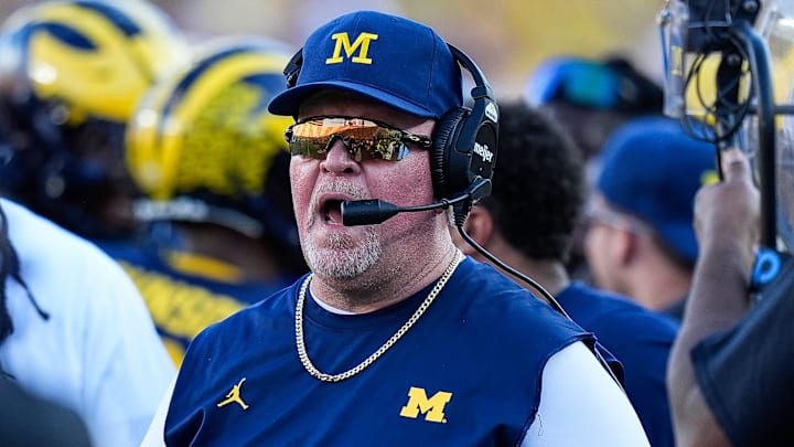 Michigan defensive coordinator Wink Martindale talks to players after a play against USC during the second half at Michigan Stadium in Ann Arbor on Saturday, Sept. 21, 2024.