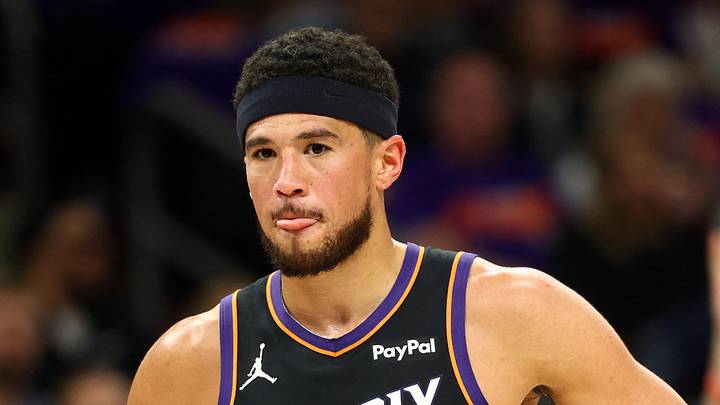 Phoenix Suns guard Devin Booker (1) reacts against the Portland Trail Blazers in the first half during the play-in rounds of the 2026 NBA Playoffs at Mortgage Matchup Center on April 14, 2026.