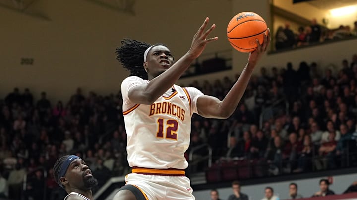 Feb 14, 2026; Santa Clara, California, USA; Santa Clara Broncos center Bukky Oboye (12) shoots against Gonzaga Bulldogs forward Graham Ike (center left) during the first half at Leavey Center. Mandatory Credit: Darren Yamashita-Imagn Images