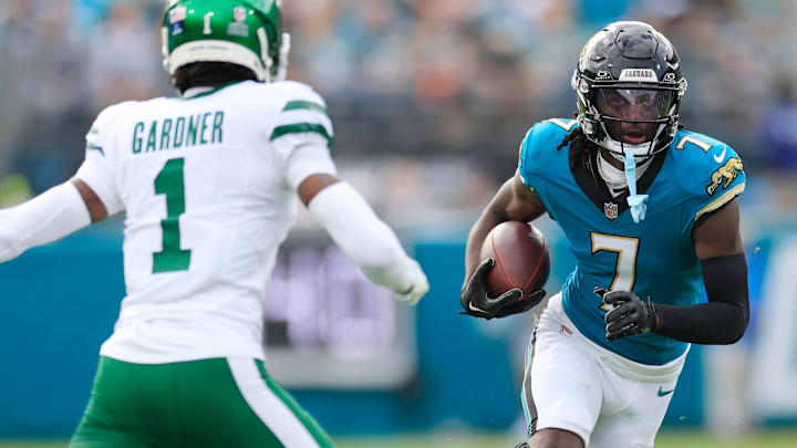 Jacksonville Jaguars wide receiver Brian Thomas Jr. (7) rushes for yards against New York Jets cornerback Sauce Gardner (1) during the first quarter Sunday, Dec. 15, 2024 at EverBank Stadium in Jacksonville, Fla. [Corey Perrine/Florida Times-Union]