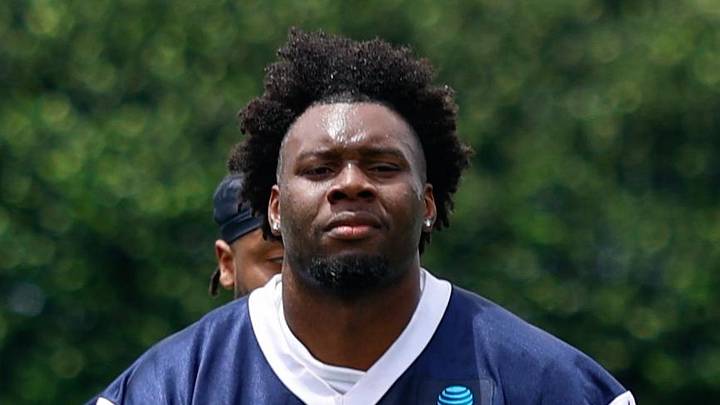 Dallas Cowboys linebacker Jr. Kenneth Murray walks off the field