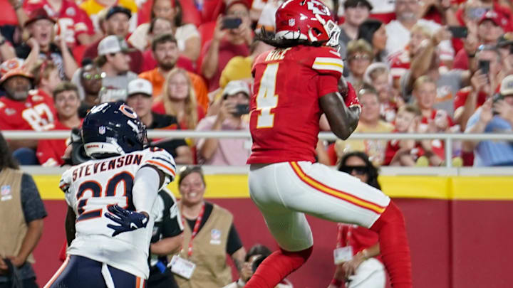 Aug 22, 2025; Kansas City, Missouri, USA; Kansas City Chiefs wide receiver Rashee Rice (4) catches a pass for a touchdown as Chicago Bears cornerback Tyrique Stevenson (29) defends during the first half of the game at GEHA Field at Arrowhead Stadium. Mandatory Credit: Denny Medley-Imagn Images