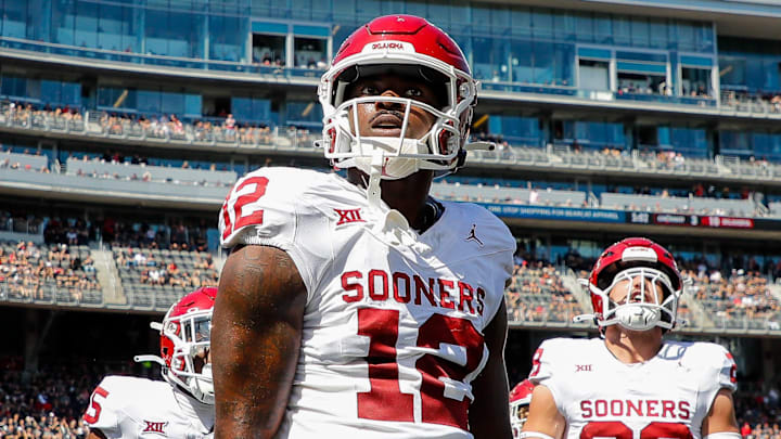 Sep 23, 2023; Cincinnati, Ohio, USA; Oklahoma Sooners defensive back Key Lawrence (12) reacts after intercepting the ball during the first half against the Cincinnati Bearcats at Nippert Stadium. Mandatory Credit: Katie Stratman-Imagn Images