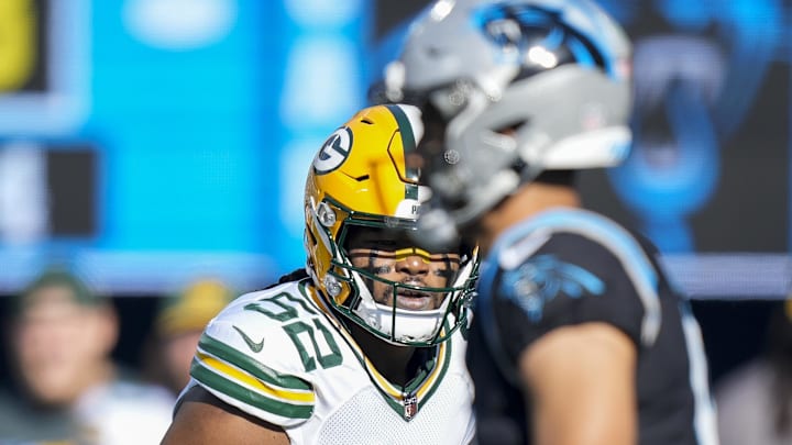Green Bay Packers linebacker Rashan Gary (52) eyes Carolina Panthers quarterback Bryce Young during their game in 2023.
