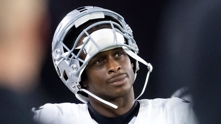 Aug 23, 2025; Glendale, Arizona, USA; Las Vegas Raiders quarterback Geno Smith (7) against the Arizona Cardinals during a preseason NFL game at State Farm Stadium. Mandatory Credit: Mark J. Rebilas-Imagn Images
