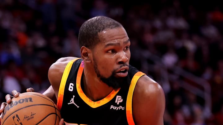 Dec 27, 2023; Houston, Texas, USA; Phoenix Suns forward Kevin Durant (35) rebounds against Houston Rockets forward Jabari Smith Jr. (10) during the first quarter at Toyota Center. Mandatory Credit: Erik Williams-Imagn Images