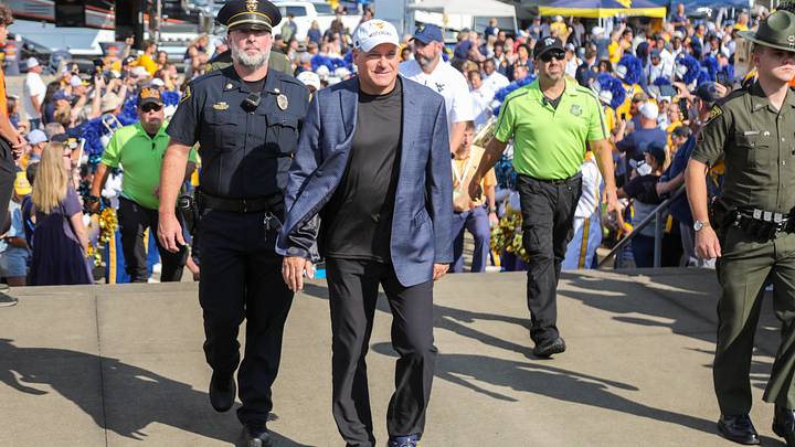 Sep 12, 2026; Morgantown, West Virginia, USA;  West Virginia Mountaineers head coach Rich Rodriguez arrives with his team on the Mantrip before their game against the UT Martin Skyhawks at Milan Puskar Stadium.  Mandatory Credit: Ben Queen-Imagn Images