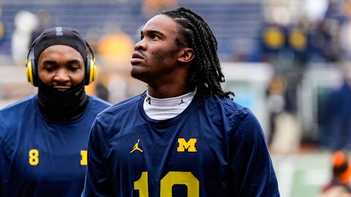 Michigan quarterback Bryce Underwood (19) looks on after warms up at Michigan Stadium in Ann Arbor on Saturday, Nov. 29, 2025. Michigan quarterback Bryce Underwood (19) looks on after warms up at Michigan Stadium in Ann Arbor on Saturday, Nov. 29, 2025.