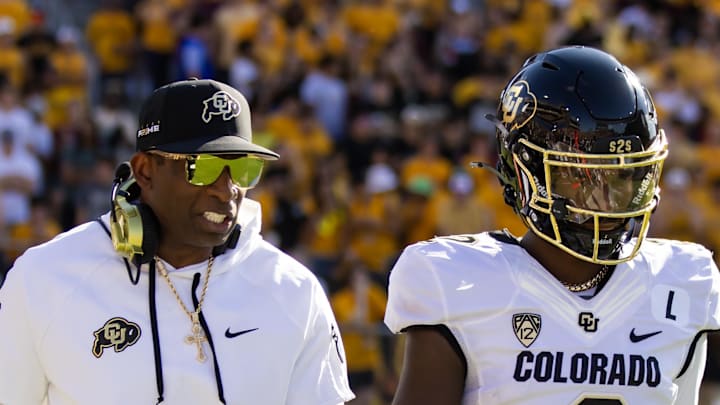 Oct 7, 2023; Tempe, Arizona, USA; Colorado Buffaloes head coach Deion Sanders with son and quarterback Shedeur Sanders (2) against the Arizona State Sun Devils at Mountain America Stadium. 