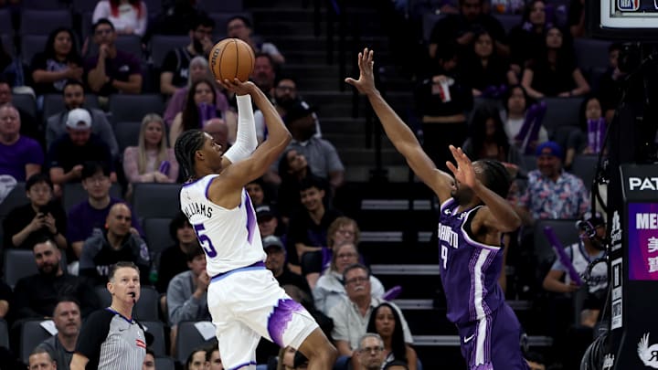 Mar 15, 2026; Sacramento, California, USA; Utah Jazz forward Cody Williams (5) shoots over Sacramento Kings forward Precious Achiuwa (9) during the second quarter at Golden 1 Center. Mandatory Credit: Dennis Lee-Imagn Images Mar 15, 2026; Sacramento, California, USA; Utah Jazz forward Cody Williams (5) shoots over Sacramento Kings forward Precious Achiuwa (9) during the second quarter at Golden 1 Center. Mandatory Credit: Dennis Lee-Imagn Images