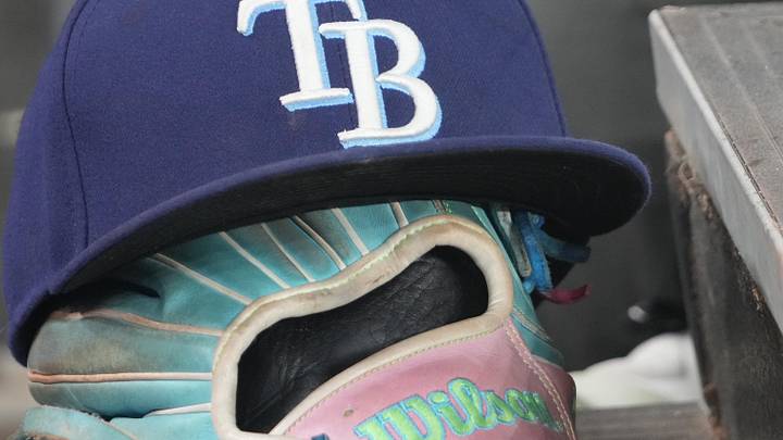 Sep 26, 2025; Toronto, Ontario, CAN; The hat and glove of Tampa Bay Rays third baseman Junior Caminero (13) in the dugout during the game against the Toronto Blue Jays at Rogers Centre. 
