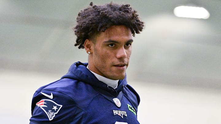 Jun 10, 2025; Foxborough, MA, USA; New England Patriots cornerback Christian Gonzalez (0) jogs to the sideline during minicamp held in the WIN Field House at Gillette Stadium. Mandatory Credit: Eric Canha-Imagn Images