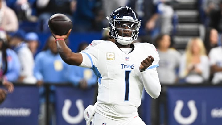 Oct 26, 2025; Indianapolis, Indiana, USA;  Tennessee Titans quarterback Cam Ward (1) warms up before the game against the Indianapolis Colts at Lucas Oil Stadium. Mandatory Credit: Robert Goddin-Imagn Images