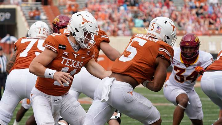 Texas Longhorns quarterback Sam Ehlinger (11) hands the ball off to running back Bijan Robinson (5) in the first quarter against the Iowa State Cyclones at Darrell K Royal-Texas Memorial Stadium. Texas Longhorns quarterback Sam Ehlinger (11) hands the ball off to running back Bijan Robinson (5) in the first quarter against the Iowa State Cyclones at Darrell K Royal-Texas Memorial Stadium.