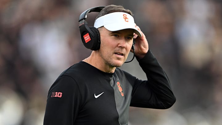 Sep 13, 2025; West Lafayette, Indiana, USA; Southern California Trojans head coach Lincoln Riley stands on the sidelines during the first quarter against the Purdue Boilermakers at Ross-Ade Stadium. Mandatory Credit: Marc Lebryk-Imagn Images Sep 13, 2025; West Lafayette, Indiana, USA; Southern California Trojans head coach Lincoln Riley stands on the sidelines during the first quarter against the Purdue Boilermakers at Ross-Ade Stadium. Mandatory Credit: Marc Lebryk-Imagn Images
