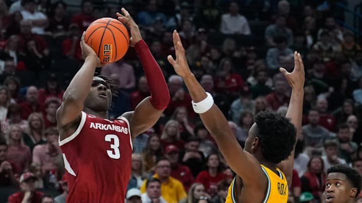 Arkansas Razorbacks forward Adou Thiero (3) attempts a shot against Baylor Bears guard Jeremy Roach (3) during the second half at American Airlines Center. 