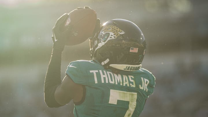 Dec 1, 2024; Jacksonville, Florida, USA; Jacksonville Jaguars wide receiver Brian Thomas Jr (7) makes the catch for the touchdown against the Houston Texans in the fourth quarter at EverBank Stadium. Mandatory Credit: Jeremy Reper-Imagn Images