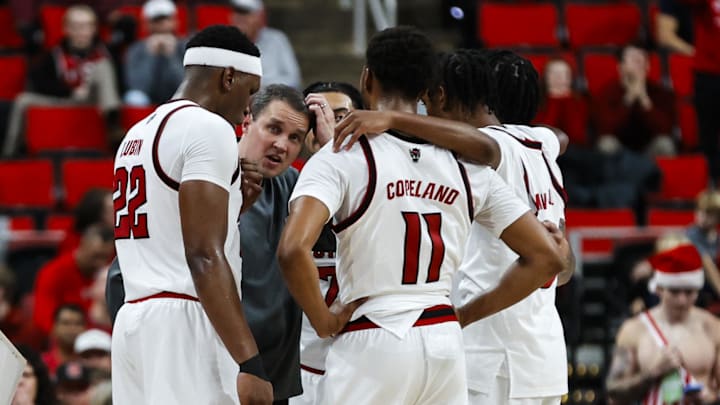 Dec 6, 2025; Raleigh, North Carolina, USA; NC State Wolfpack huddle with head coach Will Wade during the second half of the game against UNC Asheville Bulldogs at Lenovo Center. Mandatory Credit: Jaylynn Nash-Imagn Images