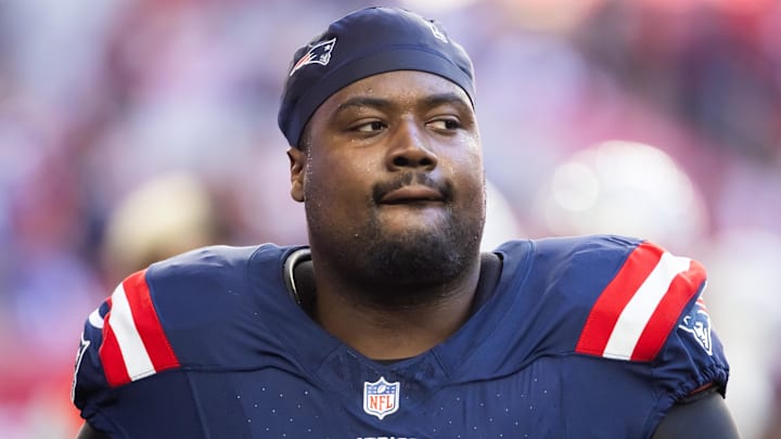 Dec 15, 2024; Glendale, Arizona, USA; New England Patriots defensive tackle Christian Barmore (90) against the Arizona Cardinals at State Farm Stadium. Mandatory Credit: Mark J. Rebilas-Imagn Images
