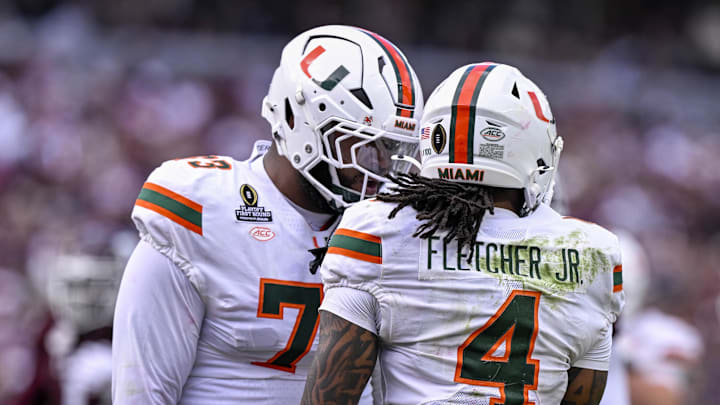 Dec 20, 2025; College Station, TX, USA; Miami Hurricanes running back Mark Fletcher Jr. (4) and offensive lineman Anez Cooper (73) celebrate during the game between the Aggies and the Hurricanes at Kyle Field. Mandatory Credit: Jerome Miron-Imagn Images