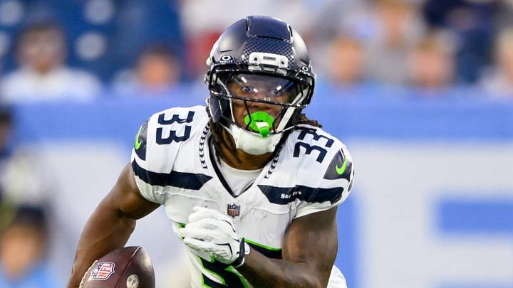 Aug 23, 2026; Nashville, Tennessee, USA;  Seattle Seahawks wide receiver Velus Jones Jr. (33) runs with the ball against the Tennessee Titans during the first half at Nissan Stadium. Mandatory Credit: Steve Roberts-Imagn Images