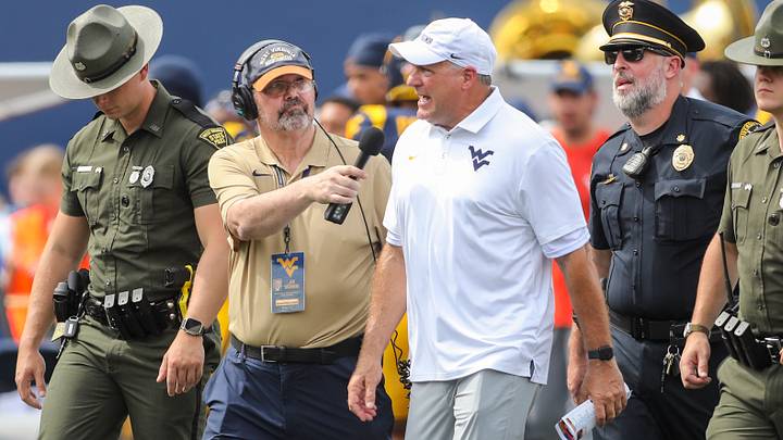 Sep 12, 2026; Morgantown, West Virginia, USA; West Virginia Mountaineers head coach Rich Rodriguez answers questions during an interview as he walks into halftime against the UT Martin Skyhawks at Milan Puskar Stadium. Mandatory Credit: Ben Queen-Imagn Images Sep 12, 2026; Morgantown, West Virginia, USA; West Virginia Mountaineers head coach Rich Rodriguez answers questions during an interview as he walks into halftime against the UT Martin Skyhawks at Milan Puskar Stadium. Mandatory Credit: Ben Queen-Imagn Images