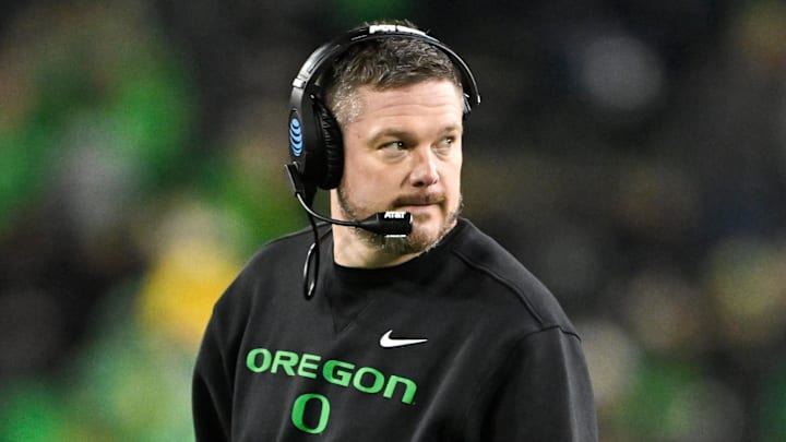 Dec 20, 2025; Eugene, OR, USA;  Oregon Ducks head coach Dan Lanning looks on during the fourth quarter against the James Madison Dukes at Autzen Stadium. Mandatory Credit: Craig Strobeck-Imagn Images