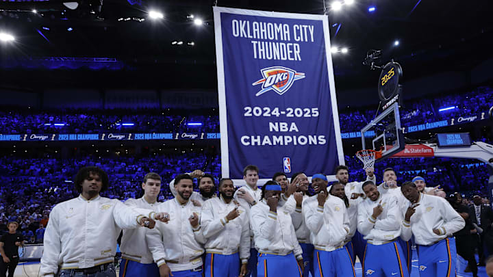 Oct 21, 2025; Oklahoma City, Oklahoma, USA; Oklahoma City Thunder celebrate as their championship banner rises behind them during the championship ring and banner ceremony before the start of their game against the Houston Rockets at Paycom Center. Mandatory Credit: Alonzo Adams-Imagn Images Oct 21, 2025; Oklahoma City, Oklahoma, USA; Oklahoma City Thunder celebrate as their championship banner rises behind them during the championship ring and banner ceremony before the start of their game against the Houston Rockets at Paycom Center. Mandatory Credit: Alonzo Adams-Imagn Images