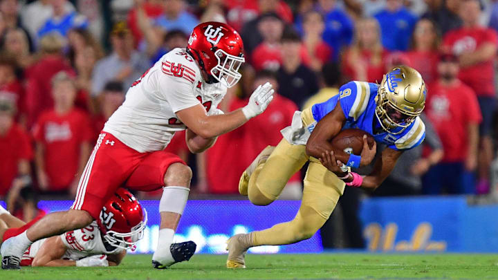 Aug 30, 2025; Pasadena, California, USA; Utah Utes defensive end John Henry Daley (90) and wide receiver Mana Carvalho (8) move in against UCLA Bruins quarterback Nico Iamaleava (9) during the first half at Rose Bowl. Mandatory Credit: Gary A. Vasquez-Imagn Images