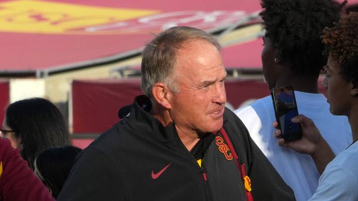 Sep 12, 2026; Los Angeles, California, USA; Southern California Trojans defensive coordinator Gary Patterson greets fans before the game against the Louisiana Ragin' Cajuns at United Airlines Field at Los Angeles Memorial Coliseum. 