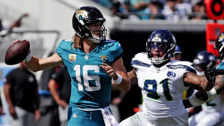 Oct 12, 2025; Jacksonville, Florida, USA; Jacksonville Jaguars quarterback Trevor Lawrence (16) drops back to throw a pass during the first half against the Seattle Seahawks at EverBank Stadium. 
