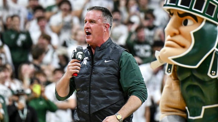 Michigan State's new football coach Pat Fitzgerald addresses the crowd during a timeout in the first half of the Spartans basketball game against Iowa on Tuesday, Dec. 2, 2025, at the Breslin Center in East Lansing.