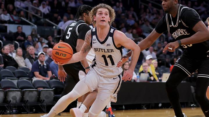 Mar 11, 2026; New York, NY, USA; Butler Bulldogs guard Finley Bizjack (11) drives to the basket against Providence Friars forward Oswin Erhunmwunse (55) during the second half at Madison Square Garden. Mandatory Credit: Brad Penner-Imagn Images Mar 11, 2026; New York, NY, USA; Butler Bulldogs guard Finley Bizjack (11) drives to the basket against Providence Friars forward Oswin Erhunmwunse (55) during the second half at Madison Square Garden. Mandatory Credit: Brad Penner-Imagn Images