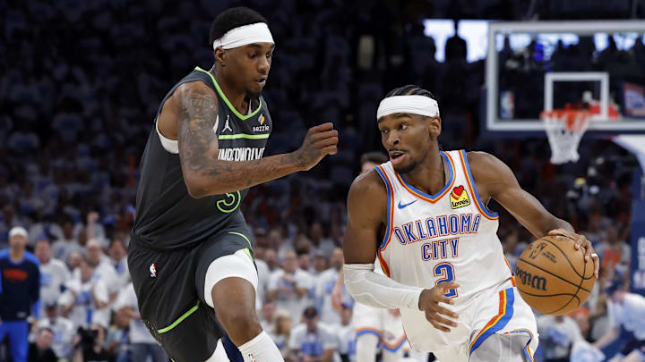 May 20, 2025; Oklahoma City, Oklahoma, USA; Oklahoma City Thunder guard Shai Gilgeous-Alexander (2) drives against Minnesota Timberwolves forward Jaden McDaniels (3) in the fourth quarter during game one of the western conference finals for the 2025 NBA Playoffs at Paycom Center. Mandatory Credit: Alonzo Adams-Imagn Images