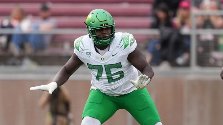 Sep 30, 2023; Stanford, California, USA; Oregon Ducks offensive lineman Josh Conerly Jr. (76) blocks against Stanford Cardinal linebacker David Bailey (23) during the second quarter at Stanford Stadium. Mandatory Credit: Darren Yamashita-Imagn Images