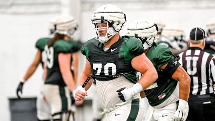 Michigan State's Luke Newman works out during camp on Monday, Aug. 5, 2024, at the indoor practice facility in East Lansing.