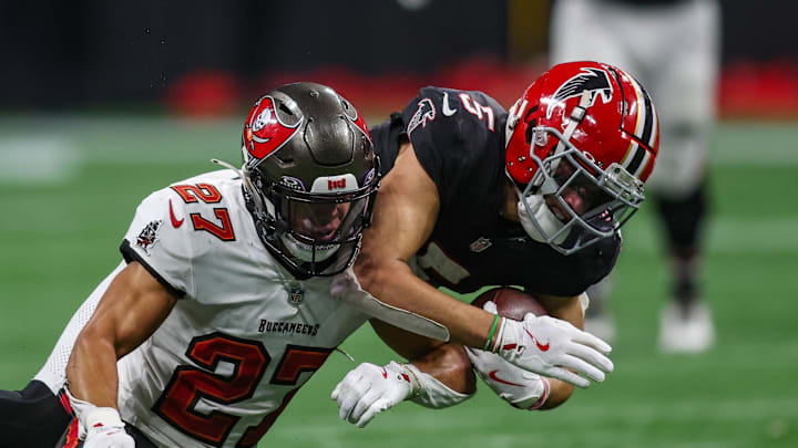 Tampa Bay Buccaneers cornerback Zyon McCollum (27) tackles Atlanta Falcons wide receiver Drake London (5) in overtime.