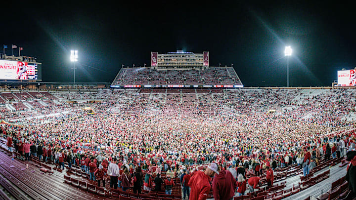 Nov 23, 2024; Norman, Oklahoma, USA; Fans rush the field after the game between the Oklahoma Sooners and the Alabama Crimson Tide at Gaylord Family-Oklahoma Memorial Stadium. Mandatory Credit: William Purnell-Imagn Images