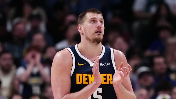 Mar 28, 2025; Denver, Colorado, USA; Denver Nuggets center Nikola Jokic (15) reacts in the third quarter against the Utah Jazz at Ball Arena.