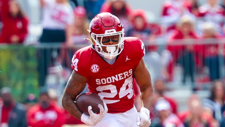 Oklahoma Sooners running back Xavier Robinson (24) runs with the ball during the second half against Ole Miss at Gaylord Family-Oklahoma Memorial Stadium. 