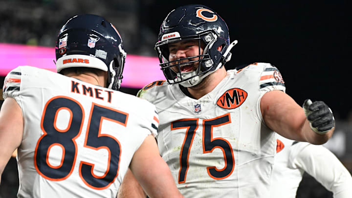 Cole Kmet and Ozzy Trapilo celebrate a Bears touchdown last season.