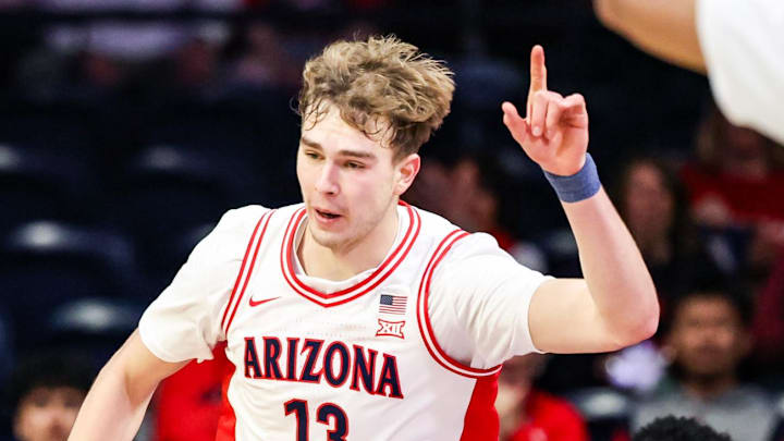 Dec 16, 2025; Tucson, Arizona, USA; Arizona Wildcats center Motiejus Krivas (13) gestures after he dunks the ball against the Abilene Christian Wildcats during the first half of the game at McKale Memorial Center. Mandatory Credit: Aryanna Frank-Imagn Images