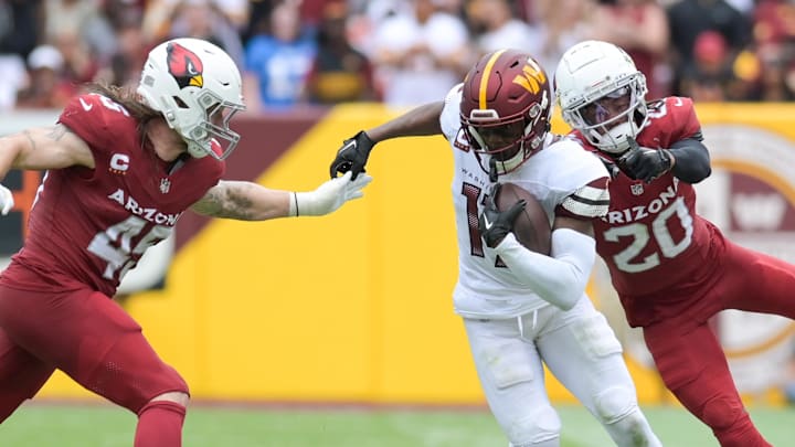 Sep 10, 2023; Landover, Maryland, USA; Washington Commanders wide receiver Terry McLaurin (17) cuts in-between Arizona Cardinals linebacker Dennis Gardeck (45) and  cornerback Marco Wilson (20) as assistant head coach/offensive coordinator Eric Bieniemy look on during the first half   at FedExField. Mandatory Credit: Tommy Gilligan-Imagn Images