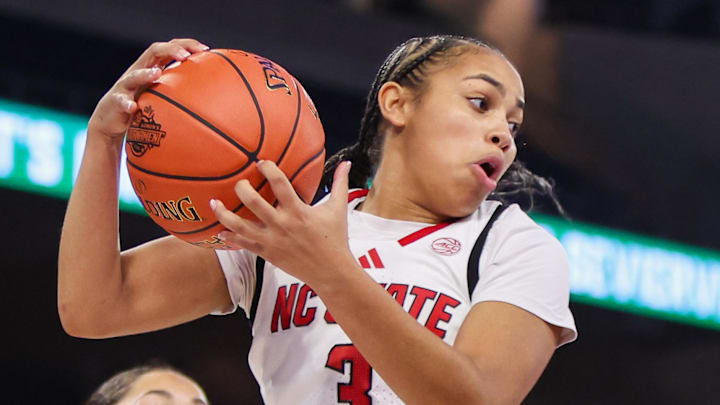 Mar 6, 2026; Duluth, GA, USA; North Carolina State Wolfpack guard Zamareya Jones (3) grabs a rebound against the Notre Dame Fighting Irish in the second quarter at Gas South Arena. Mandatory Credit: Brett Davis-Imagn Images