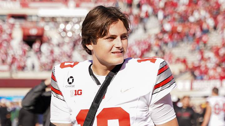 Oct 17, 2026; Bloomington, Indiana, USA; Ohio State Buckeyes quarterback Julian Sayin (10) walks off the field with his arm in a sling after the game against the Indiana Hoosiers Merchants Bank Field at Memorial Stadium. Mandatory Credit: Robert Goddin-Imagn Images
