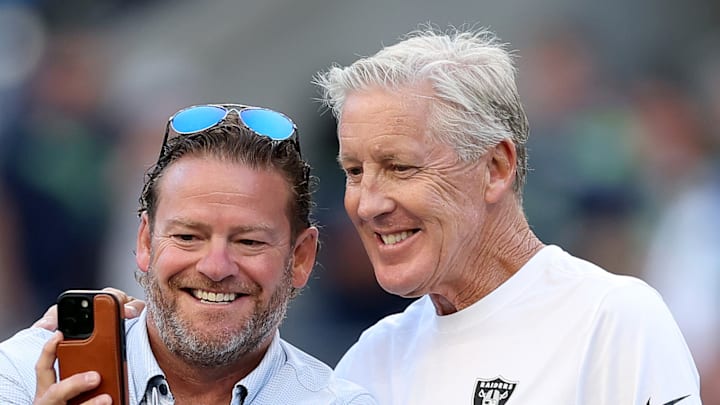 John Schneider and Pete Carroll take a photo