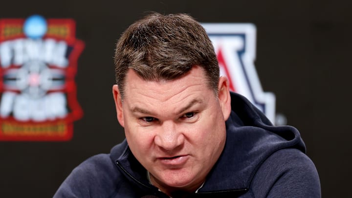 Apr 3, 2026; Indianapolis, IN, USA; Arizona Wildcats head coach Tommy Lloyd speaks during a press conference ahead of the Final Four of the men's 2026 NCAA Tournament at Lucas Oil Stadium. Mandatory Credit: Trevor Ruszkowski-Imagn Images Apr 3, 2026; Indianapolis, IN, USA; Arizona Wildcats head coach Tommy Lloyd speaks during a press conference ahead of the Final Four of the men's 2026 NCAA Tournament at Lucas Oil Stadium. Mandatory Credit: Trevor Ruszkowski-Imagn Images